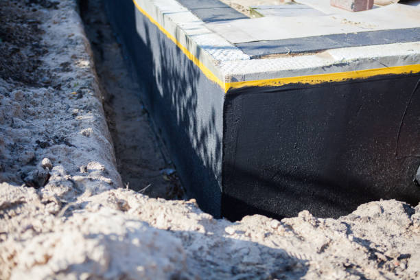 Professional Waterproofing technician working in Covington, OH